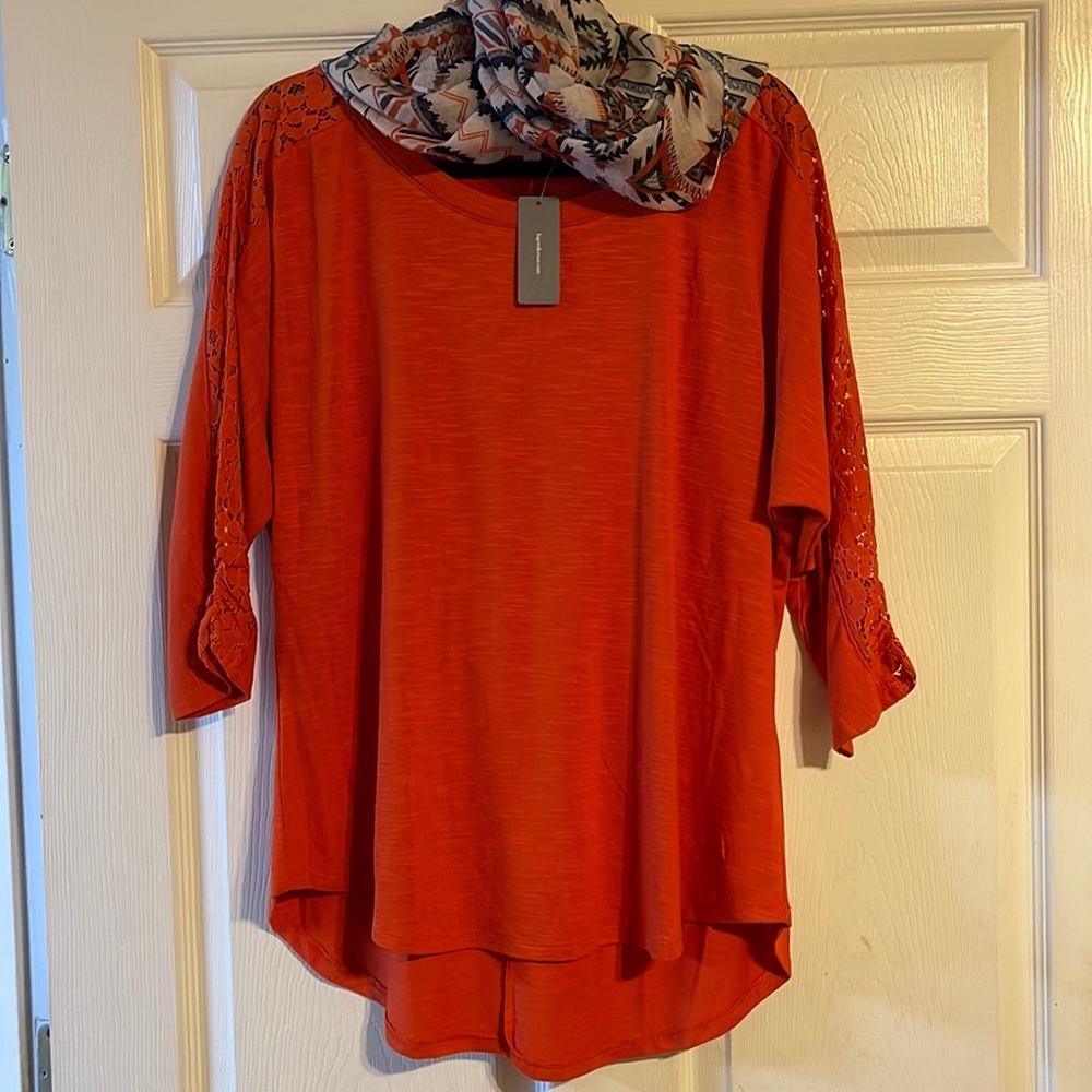 Orange top with pattern down 3/4 sleeve comes with matching scarf!